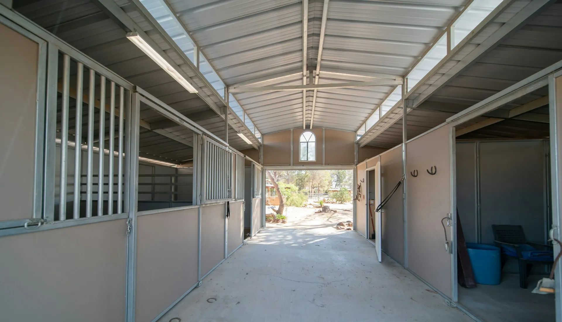 A sunlit barn aisle